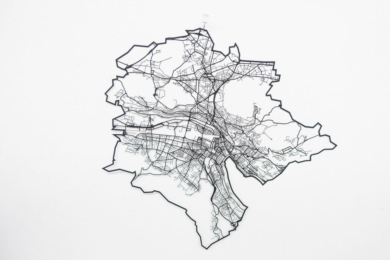 Lasercut street network of zurich in paper - hanging on wall