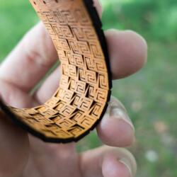 Lasercut bendable wood - Arm bracelet in yellow - View of backside