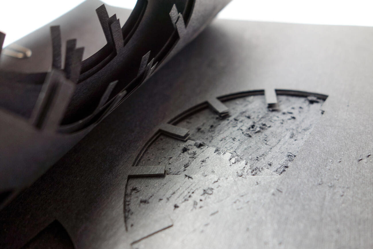 Layers of an abstract clock. Graphic design and laser cut.