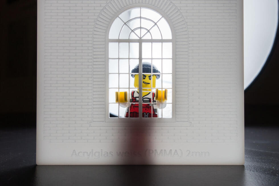 Laser engraving in white acrylic with LEGO minifigure