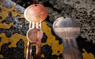 Details of lasercut geometric jewelery made from bronze engraved with a Trotec fiber laser