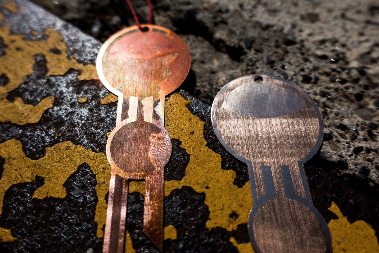 Details of lasercut geometric jewelery made from bronze engraved with a Trotec fiber laser